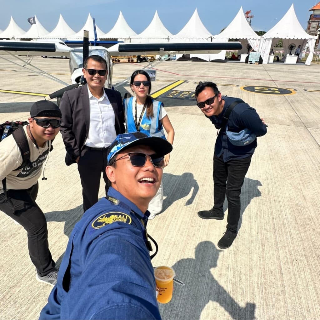 Sipilot community members at a Bali air show with a light aircraft